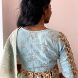 Light blue embroidered cotton blouse with pleats