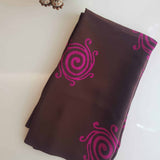 Dark brown Crepe silk fabric with pink printed geometric design