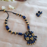 Blue and gold geometric designed handmade terracotta necklace with birds pendant