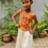 Orange velvet top with off white skirt