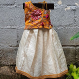 Orange velvet top with off white skirt