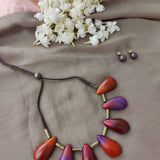 Red,orange,violet and magenta handmade terracotta necklace with leaf shaped design and earrings