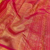 Sumangala - Golden mustard and rani pink handwoven Kanchipuram silk saree with zari checks and border