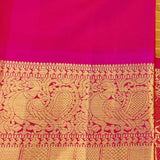 Sumangala - Golden mustard and rani pink handwoven Kanchipuram silk saree with zari checks and border