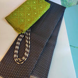 Meera-Black and green handwoven Kanchipuram silk saree with small zari buttis