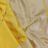 Yellow handwoven pure silk saree with geometric stripes in Benaras weave