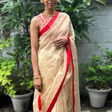 Cream with red satin border organza silk saree