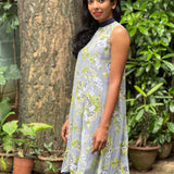 Apple green, cream and white floral on grey chiffon sleeveless dress with navy blue collar band