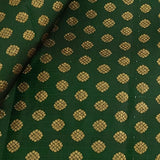 Dark green Kanchi silk fabric with flower motifs