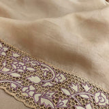 Jhalar beige plum organza cutwork saree