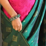 Mila pink green organza kanchipuram saree