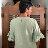 Green embroidered linen top