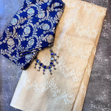 Beige and white embroidered tussar saree