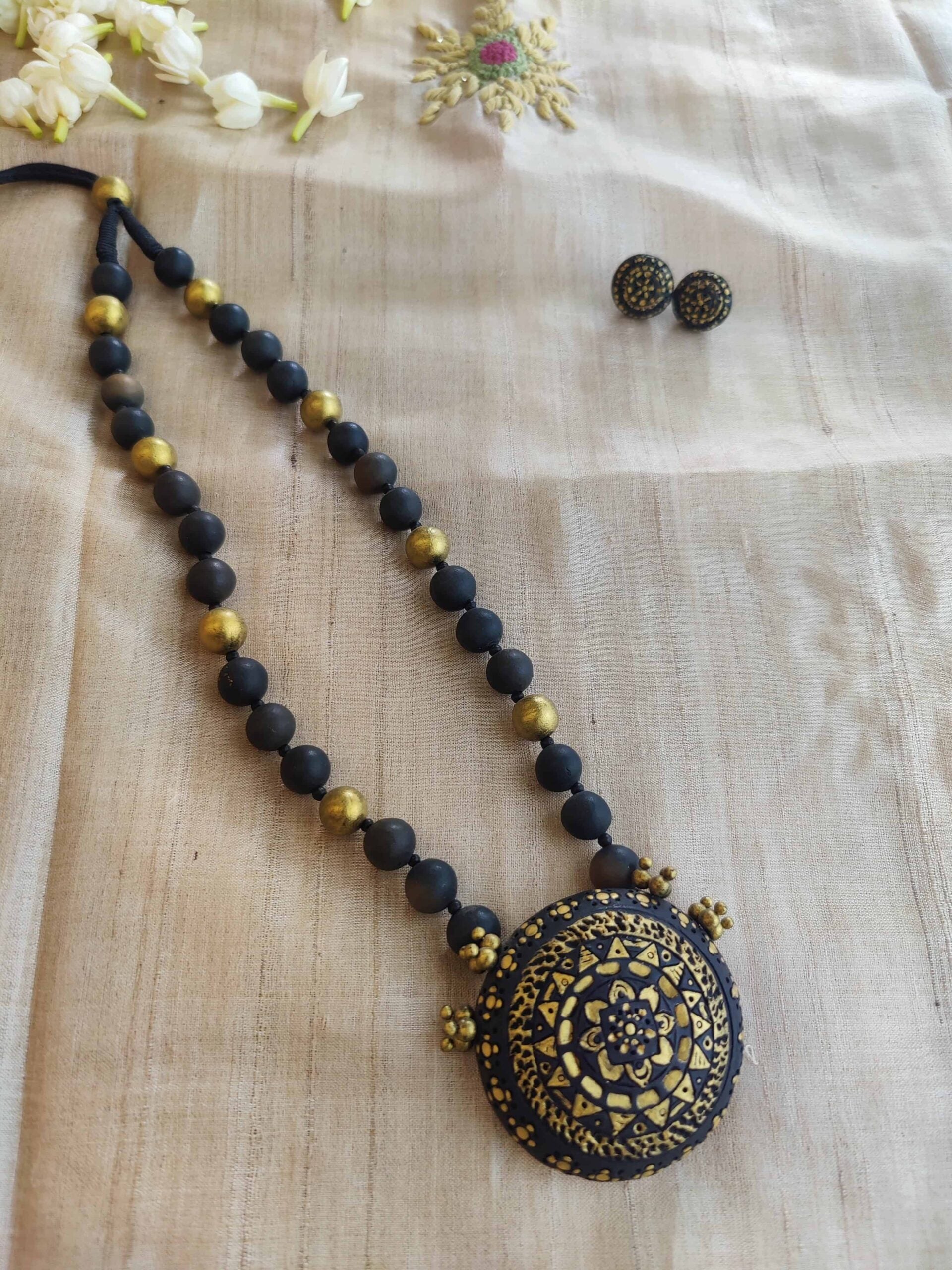 Black-and-gold-handmade-terracotta-beaded-necklace-with-pendant-and-tops-3.jpg