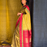 Haathee Crossing Offset Border Kanchi Silk Saree - Olive