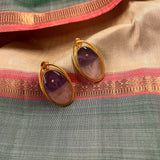 Oval brass earring