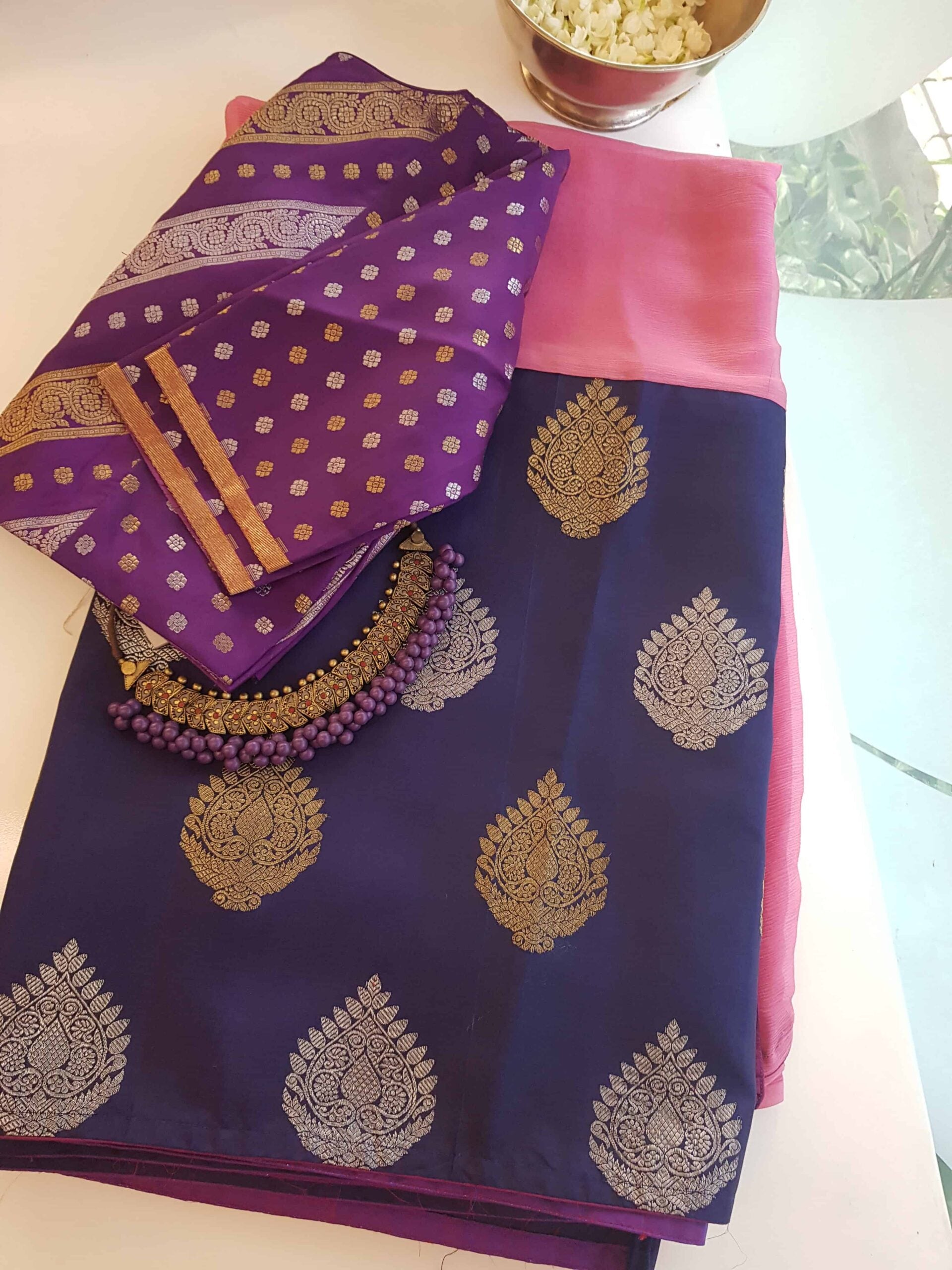 Light-pink-and-navy-blue-chiffon-saree-with-attached-Kanchi-silk-border-rotated-1.jpg