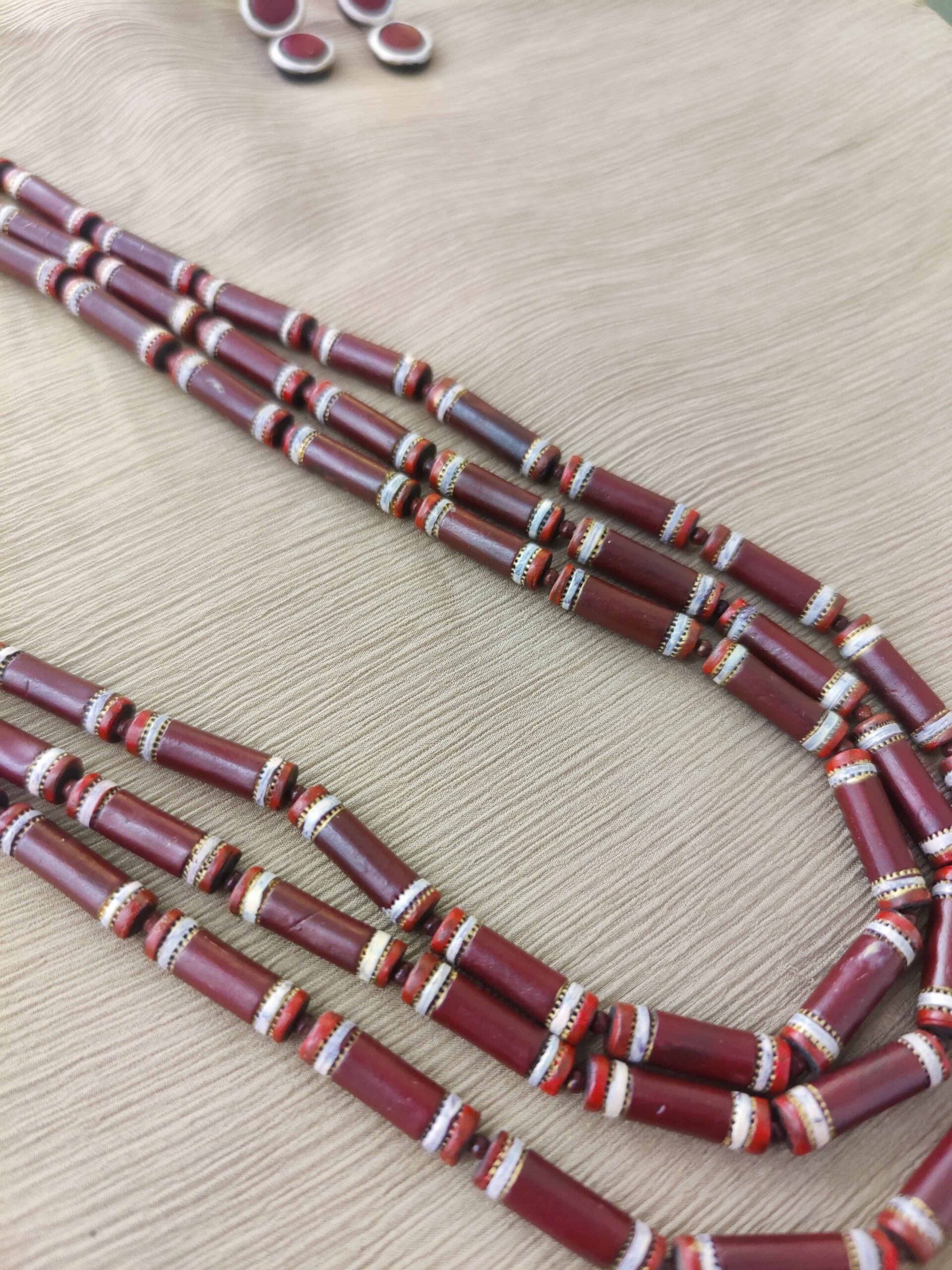 Maroon-and-white-three-layred-handmade-terracotta-necklace-with-earrings-2-1.jpg