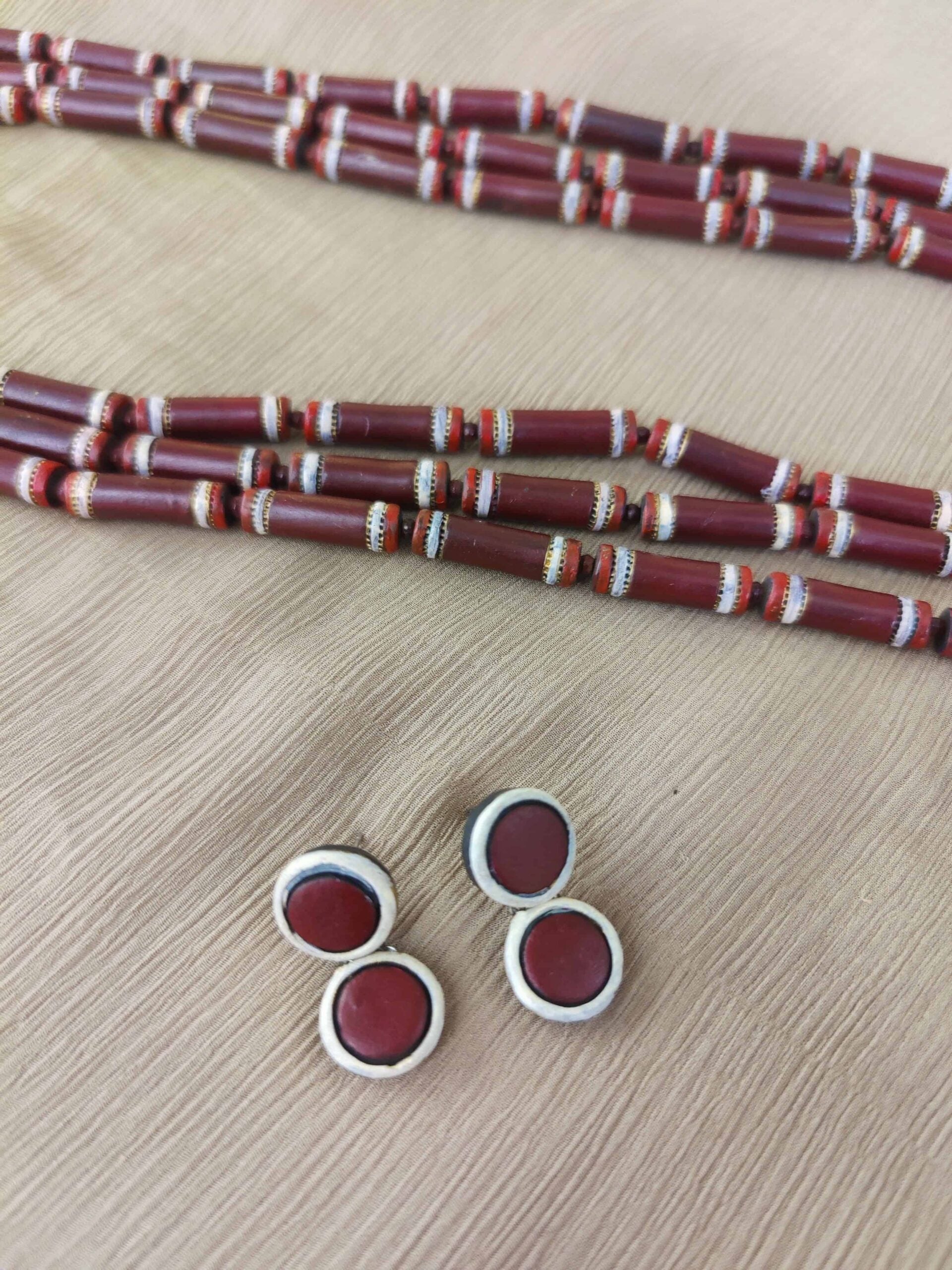 Maroon-and-white-three-layred-handmade-terracotta-necklace-with-earrings-3-1.jpg