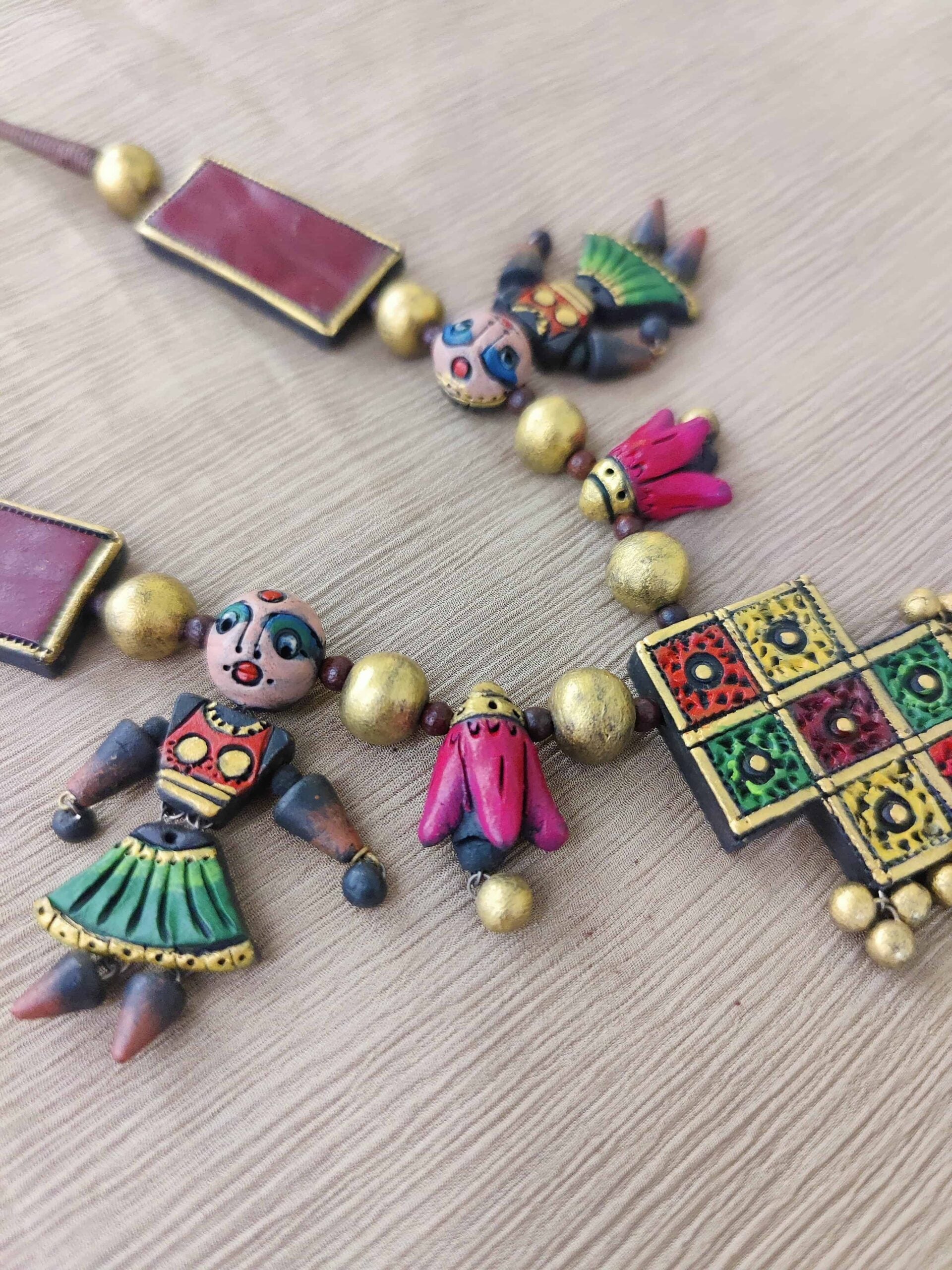 Multicoloured-fancy-handmade-terracotta-necklace-with-diamond-shaped-pendant-and-earrings-2-1.jpg