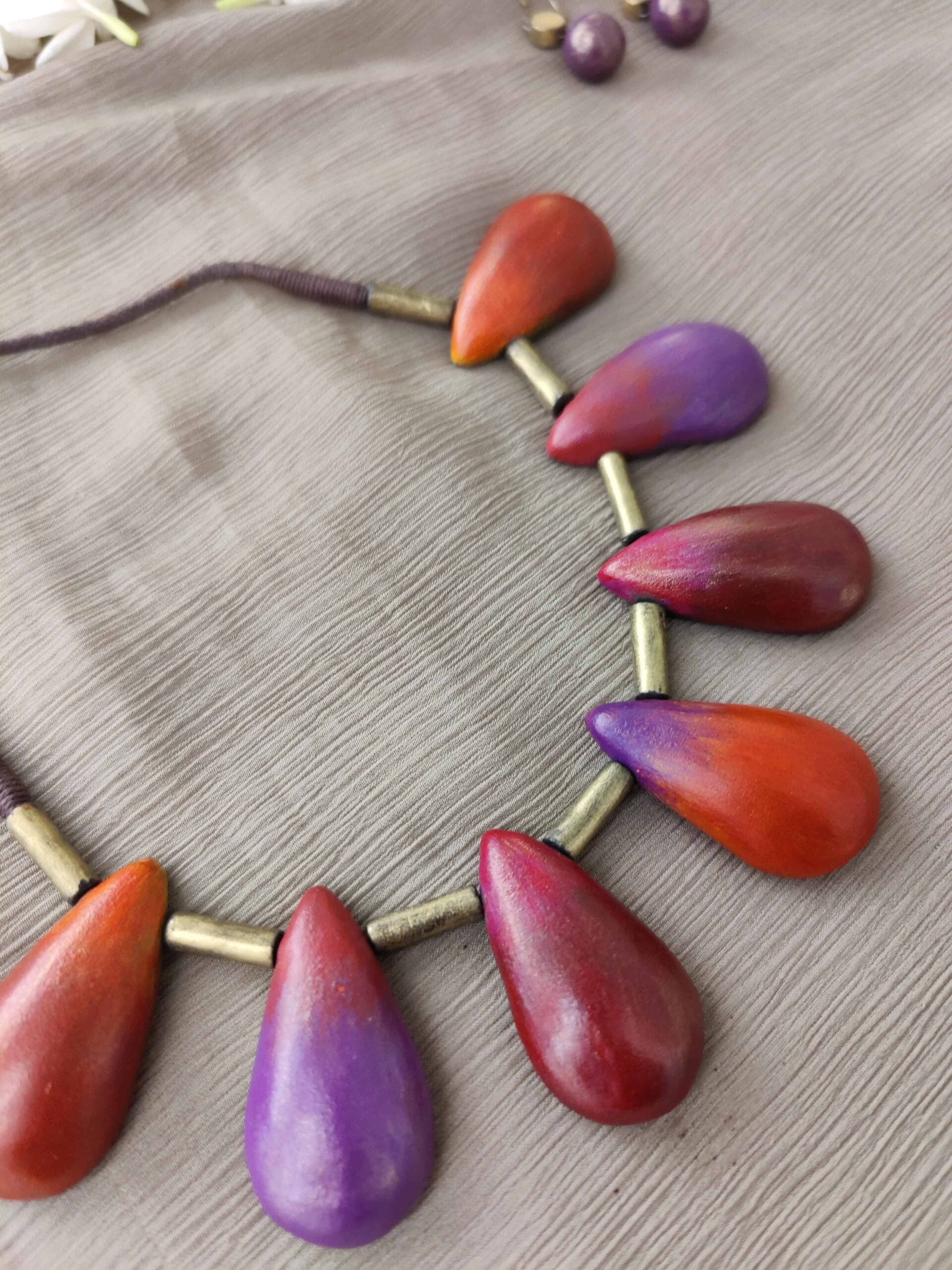 Redorangeviolet-and-magenta-handmade-terracotta-necklace-with-leaf-shaped-design-2-1.jpg