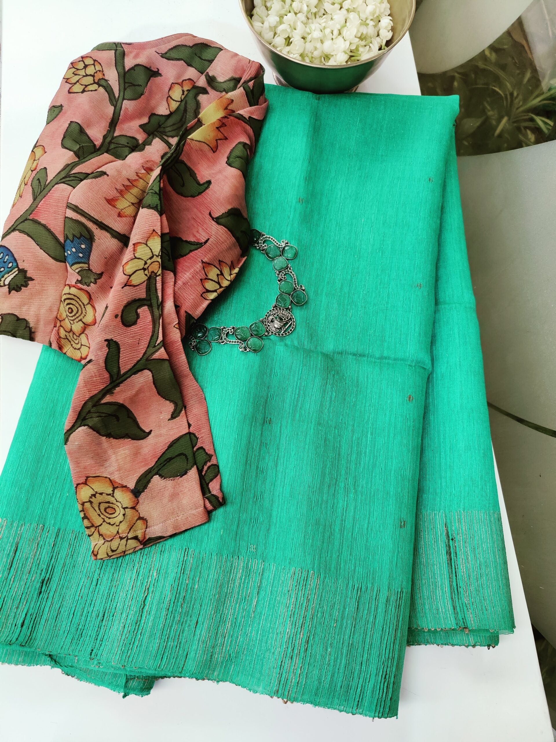 Teal-and-beige-handwoven-Matka-silk-saree-with-sequins-and-floral-on-the-pallu-2.jpg