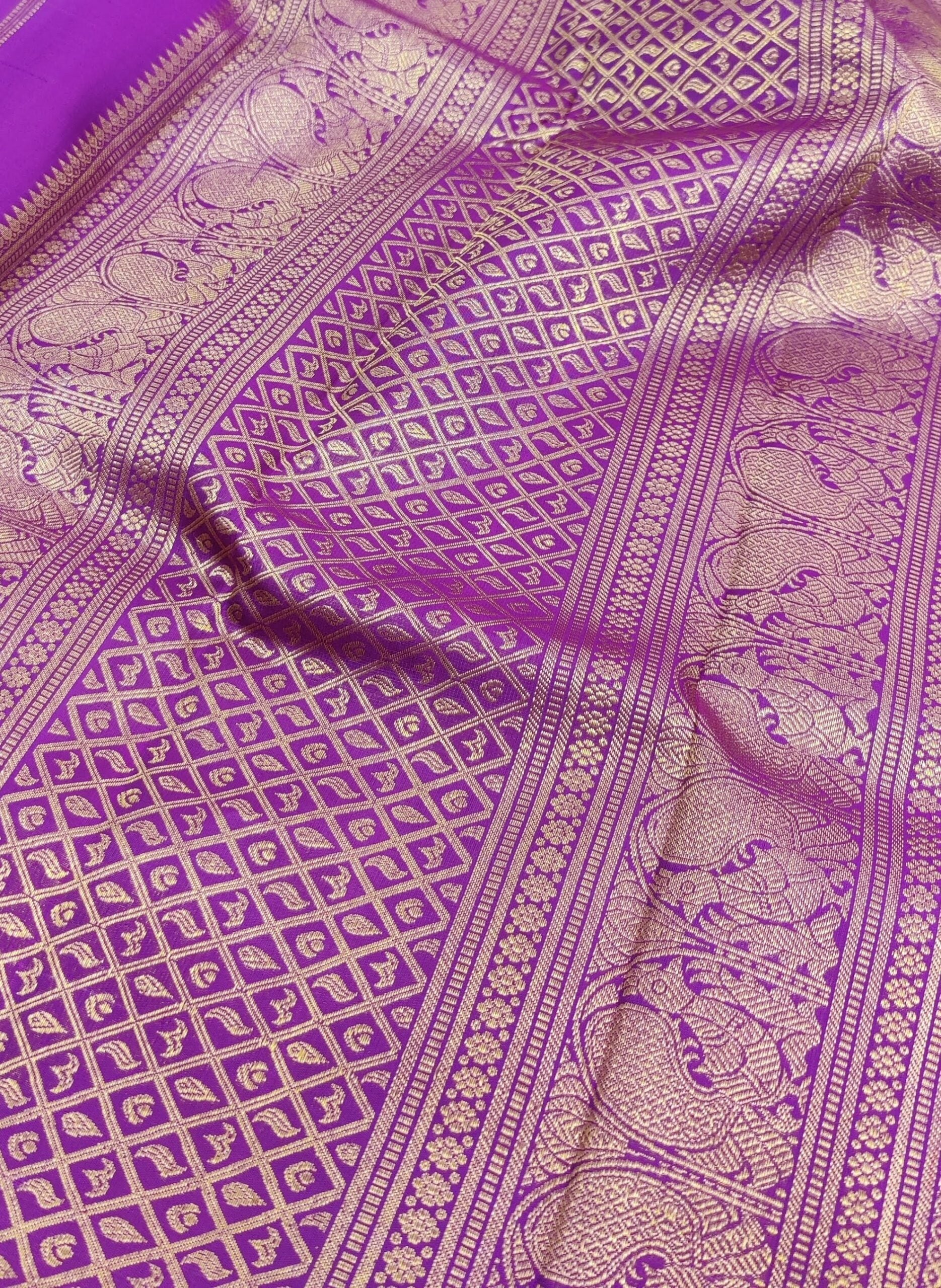 Violet-handwoven-Kanchipuram-silk-saree-with-flower-buttis-2.jpg