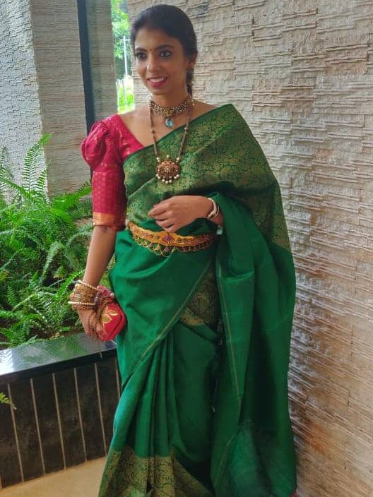 Green-kanchipuram-silk-saree-with-contrast-blouse-
