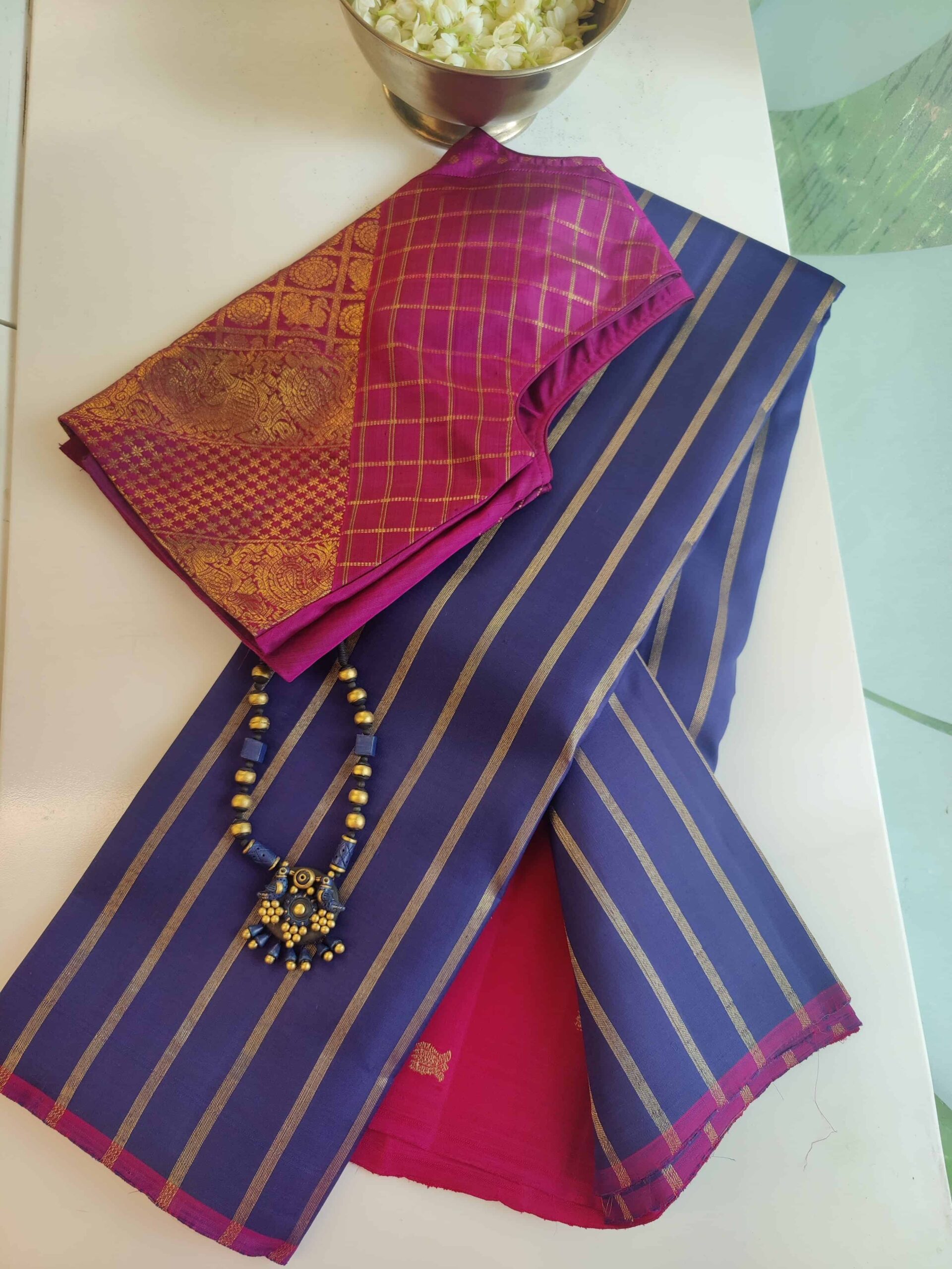 Iced mocha Kanchipuram silk sleeveless blouse with Jhaalar pattern