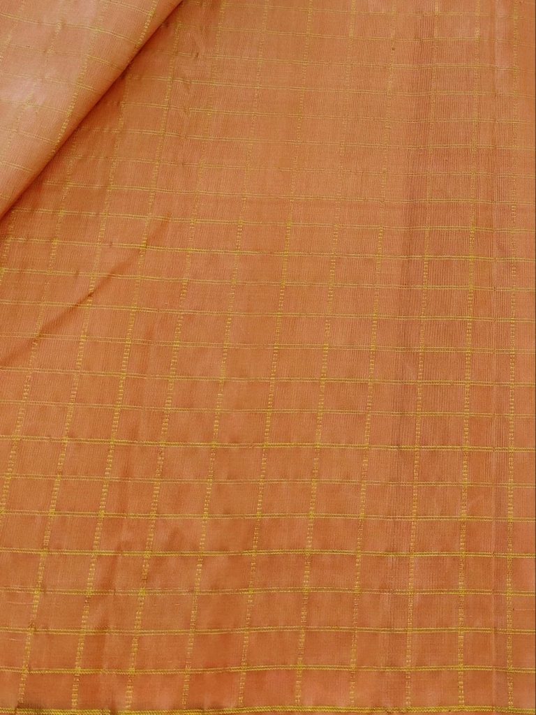 Peach-Kanchipuram-silk-fabric-with-zari-checks