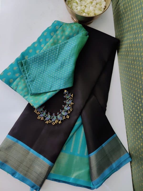Black kanchipuram silk saree with teal border