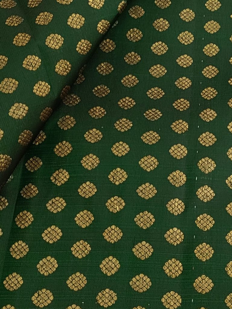 Dark green Kanchi silk fabric with flower motifs