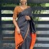 Lavanyam - black Kanchipuram silk saree with orange simple pallu