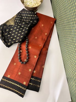 Vera - Rust and black kanchipuram silk saree with twin zari line border